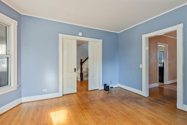 2 Elm Ter, Waterville, ME 04901 - spare room with hardwood / wood-style floors, baseboards, ornamental molding, and stairs