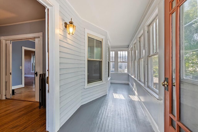 2 Elm Ter, Waterville, ME 04901 - unfurnished sunroom featuring hardwood / wood-style floors, plenty of natural light, baseboards, and crown molding