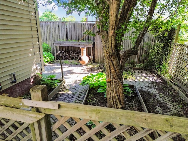 2 Elm Ter, Waterville, ME 04901 - fenced backyard featuring a patio