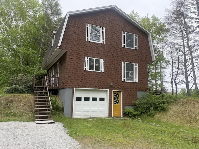 593 S Strong Rd, Strong, ME 04983 - view of side of property with an attached garage, driveway, a gambrel roof, and stairway