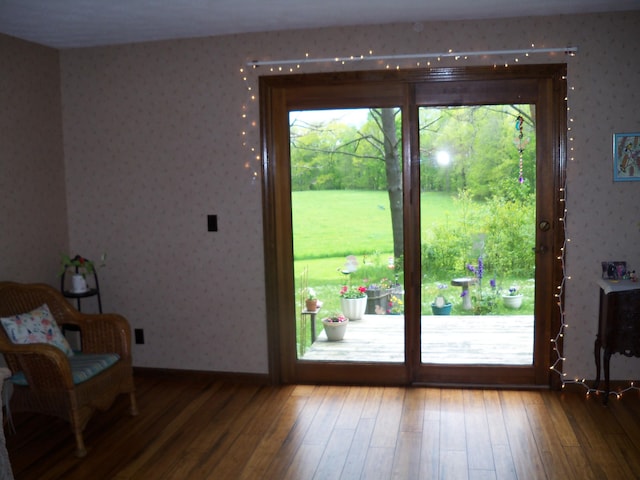 593 S Strong Rd, Strong, ME 04983 - doorway to outside with wallpapered walls and hardwood / wood-style flooring