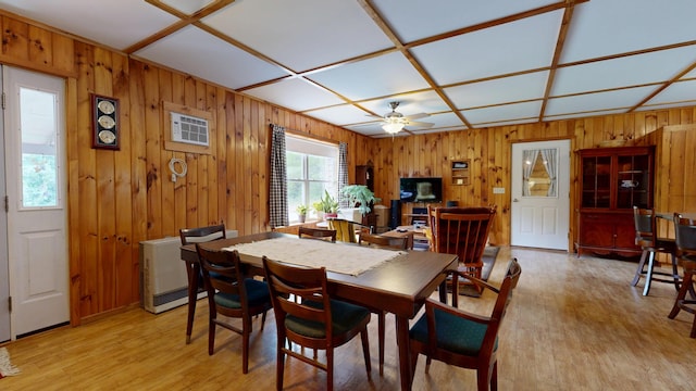 574 Scribner Hill Rd, Otisfield, ME 04270 - dining room with a ceiling fan, light wood-style floors, and wooden walls