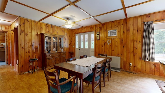 574 Scribner Hill Rd, Otisfield, ME 04270 - dining room with ceiling fan, wood walls, and light wood-style flooring