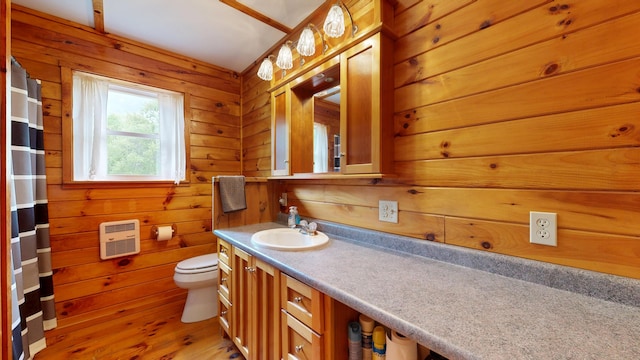 574 Scribner Hill Rd, Otisfield, ME 04270 - full bath featuring heating unit, toilet, vanity, wood walls, and wood finished floors