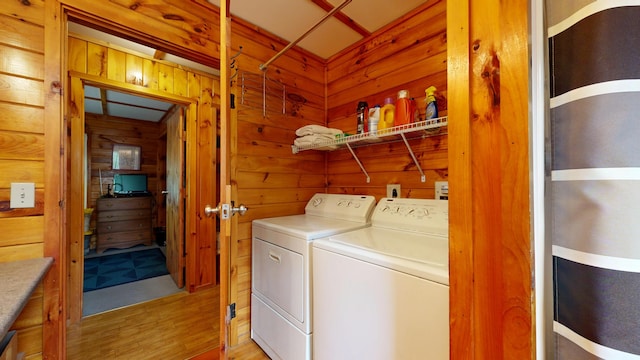 574 Scribner Hill Rd, Otisfield, ME 04270 - laundry room featuring washer and clothes dryer, wooden walls, and light wood-style flooring