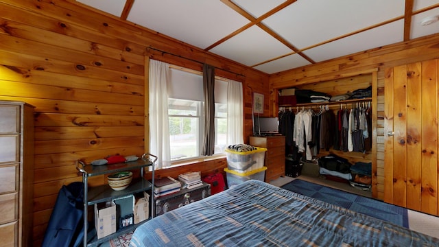 574 Scribner Hill Rd, Otisfield, ME 04270 - bedroom featuring wooden walls, carpet floors, and a closet