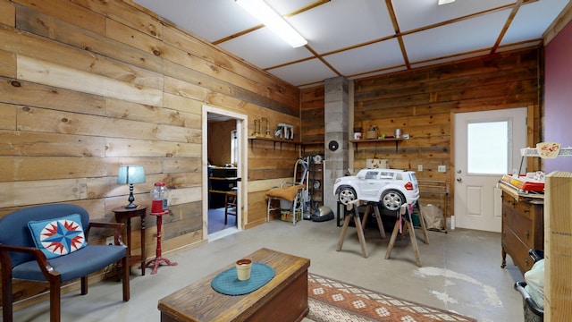 574 Scribner Hill Rd, Otisfield, ME 04270 - living room with wood walls and concrete floors
