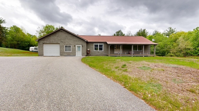 574 Scribner Hill Rd, Otisfield, ME 04270 - ranch-style home featuring a garage, a porch, asphalt driveway, metal roof, and a front yard