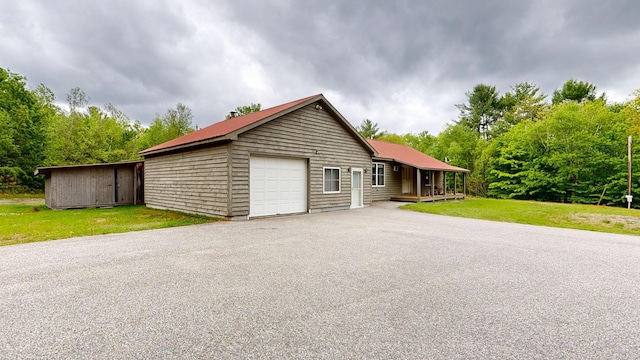 574 Scribner Hill Rd, Otisfield, ME 04270 - view of front of home with a front yard, metal roof, and driveway
