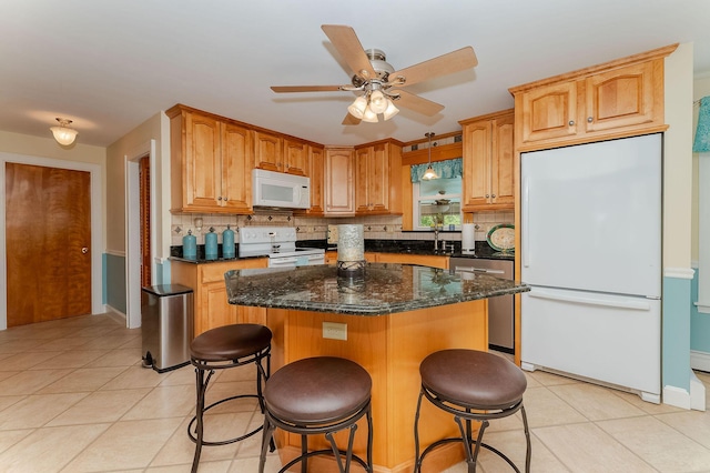 5 Nash Pkwy, Somersworth, NH 03878 - kitchen featuring white appliances, decorative backsplash, and light tile patterned flooring