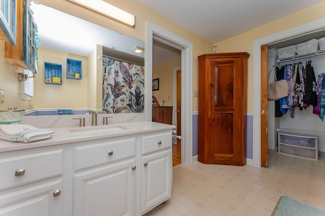 5 Nash Pkwy, Somersworth, NH 03878 - full bath with vanity, tile patterned floors, and a walk in closet