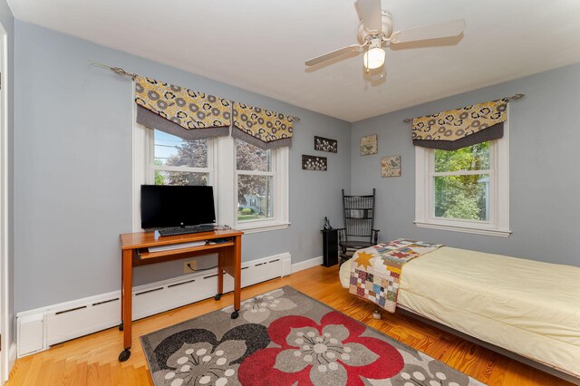 5 Nash Pkwy, Somersworth, NH 03878 - bedroom with wood finished floors, a baseboard heating unit, and ceiling fan