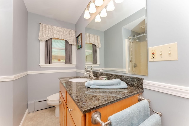 5 Nash Pkwy, Somersworth, NH 03878 - full bathroom with a baseboard heating unit, vanity, toilet, a shower with door, and baseboards