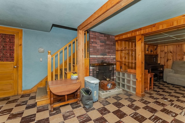 5 Nash Pkwy, Somersworth, NH 03878 - finished below grade area featuring tile patterned floors, stairway, and a wood stove