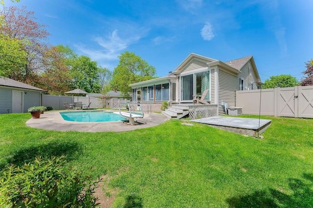 5 Nash Pkwy, Somersworth, NH 03878 - rear view of house featuring a sunroom, a patio area, and a deck