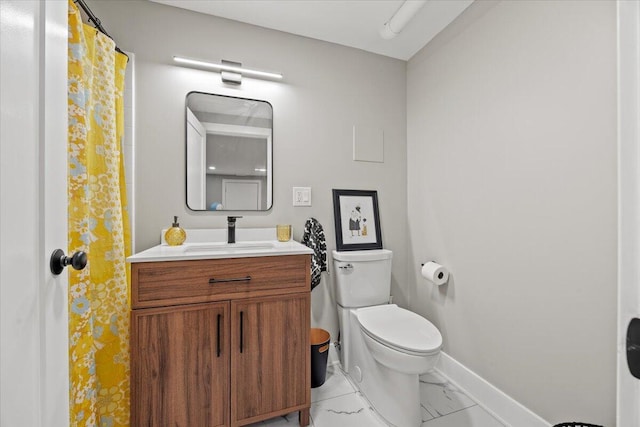 4 Frontrunner Way, Scarborough, ME 04074 - bathroom with baseboards, marble look tiles, toilet, and vanity