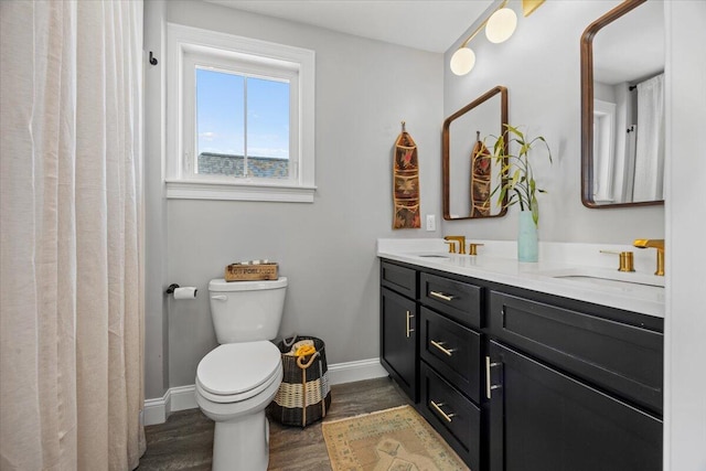 4 Frontrunner Way, Scarborough, ME 04074 - full bath with wood finished floors, double vanity, baseboards, and toilet