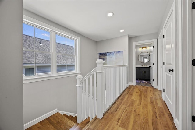 4 Frontrunner Way, Scarborough, ME 04074 - hall featuring an upstairs landing, light wood-style flooring, baseboards, and recessed lighting