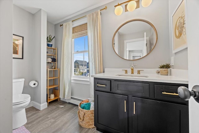 4 Frontrunner Way, Scarborough, ME 04074 - bathroom featuring wood finished floors, vanity, toilet, and baseboards