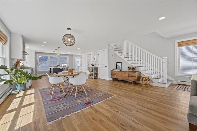 4 Frontrunner Way, Scarborough, ME 04074 - dining room with stairs, a chandelier, light wood-style floors, baseboard heating, and recessed lighting