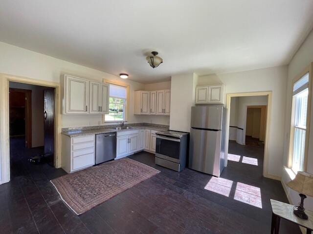 119 Village Rd, Steuben, ME 04680 - kitchen featuring stainless steel appliances, dark wood-style flooring, a sink, and light countertops