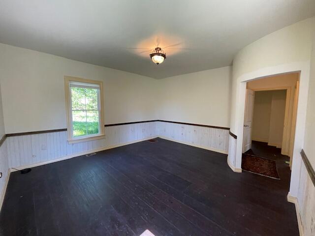 119 Village Rd, Steuben, ME 04680 - unfurnished room featuring hardwood / wood-style floors and wainscoting