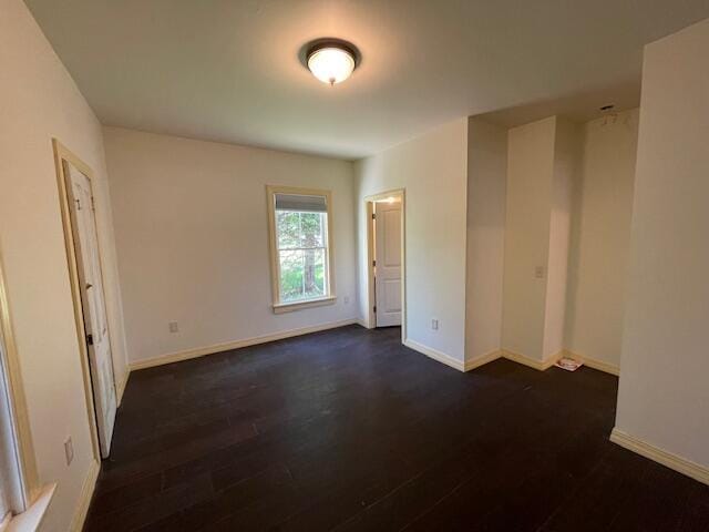 119 Village Rd, Steuben, ME 04680 - empty room with dark wood-style flooring and baseboards