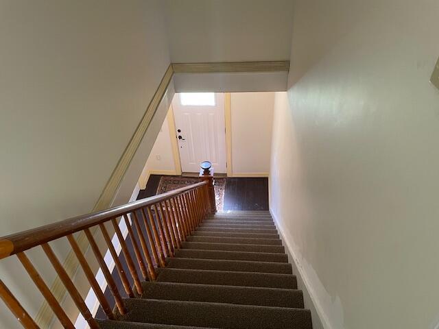 119 Village Rd, Steuben, ME 04680 - staircase featuring baseboards