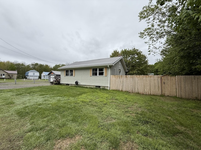 13 Lindsay St, Lincoln, ME 04457 - view of side of home featuring metal roof