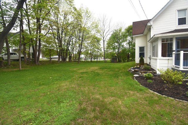 164 Nichols St, Pittsfield, ME 04967 - view of grassy yard featuring a sunroom