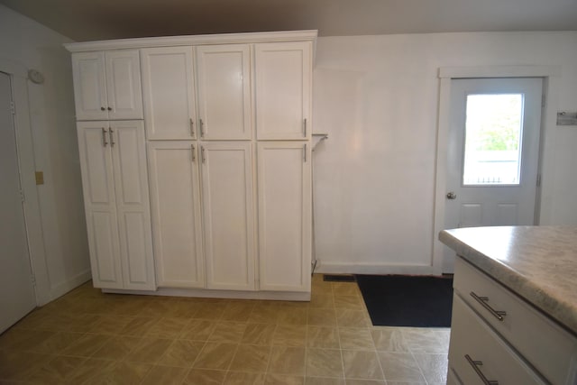 164 Nichols St, Pittsfield, ME 04967 - kitchen with white cabinets and light countertops