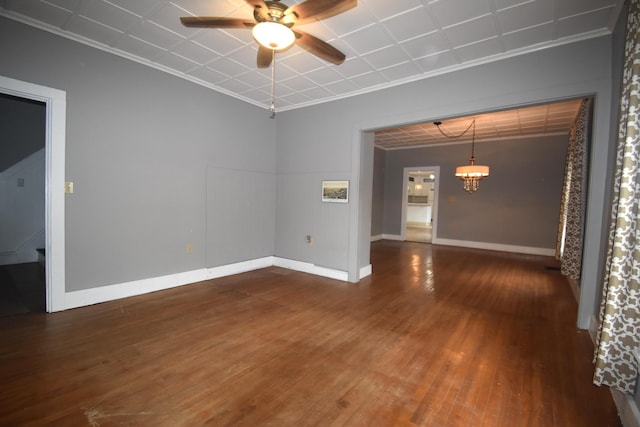 164 Nichols St, Pittsfield, ME 04967 - spare room featuring a ceiling fan, wood finished floors, ornamental molding, baseboards, and a chandelier