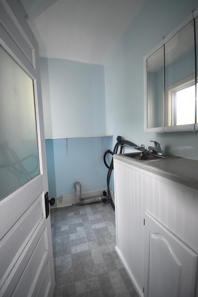 164 Nichols St, Pittsfield, ME 04967 - laundry area featuring baseboards and a sink