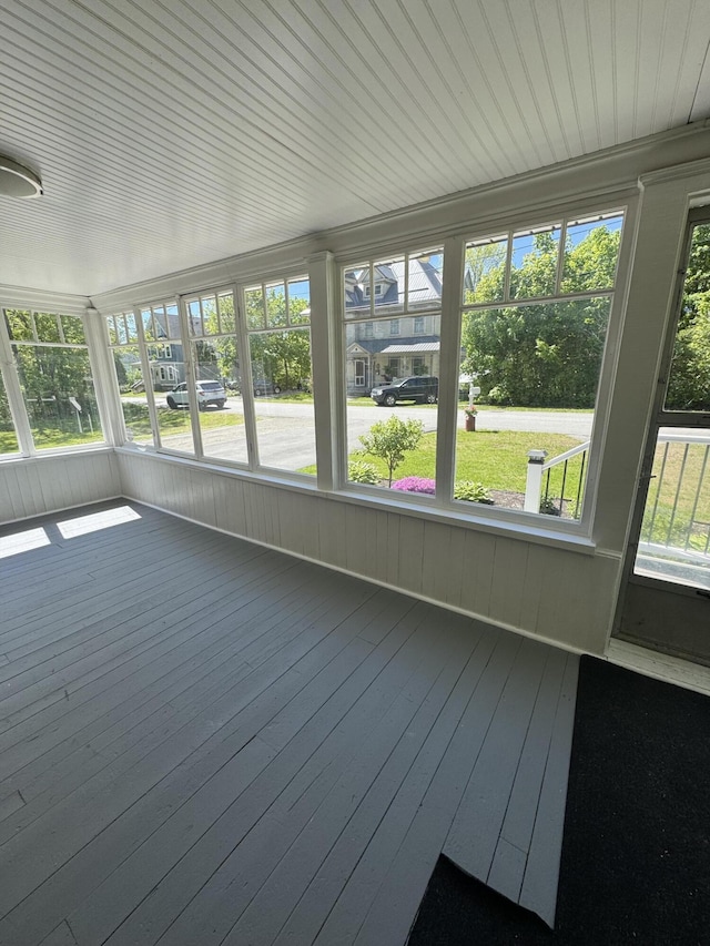 164 Nichols St, Pittsfield, ME 04967 - unfurnished sunroom with healthy amount of natural light, wood-type flooring, and wood walls