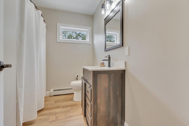 67 Overlook Rd, Windham, ME 04062 - full bathroom with baseboard heating, vanity, toilet, wood finished floors, and a shower with curtain