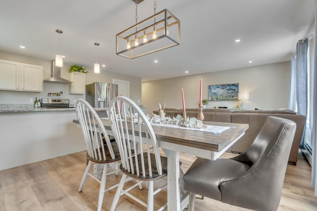 67 Overlook Rd, Windham, ME 04062 - dining area featuring light wood finished floors, recessed lighting, and a chandelier