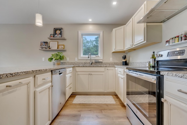 67 Overlook Rd, Windham, ME 04062 - kitchen with stainless steel appliances, under cabinet range hood, light wood finished floors, open shelves, and light stone countertops