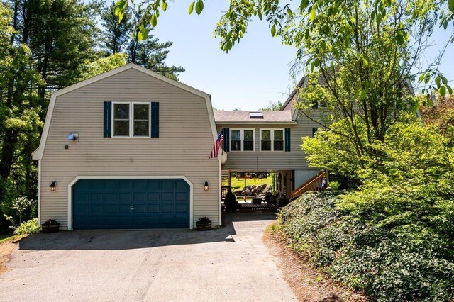 6 Sand Pond Rd, North Berwick, ME 03906 - view of front of home featuring a gambrel roof, an attached garage, asphalt driveway, and a shingled roof