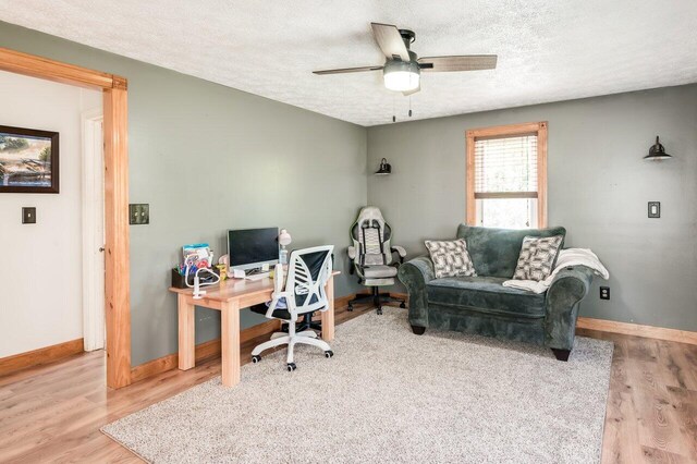 6 Sand Pond Rd, North Berwick, ME 03906 - home office featuring baseboards, a textured ceiling, wood finished floors, and a ceiling fan
