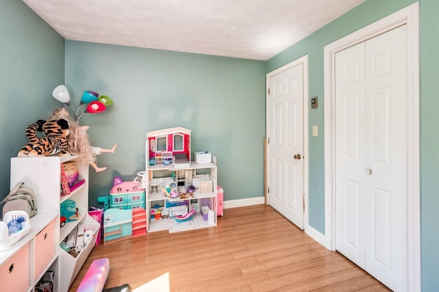 6 Sand Pond Rd, North Berwick, ME 03906 - rec room featuring wood finished floors, a textured ceiling, and baseboards