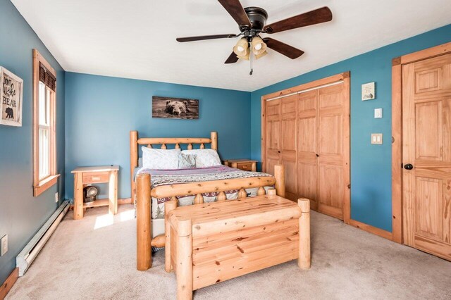 6 Sand Pond Rd, North Berwick, ME 03906 - bedroom with baseboard heating, light colored carpet, a closet, baseboards, and ceiling fan