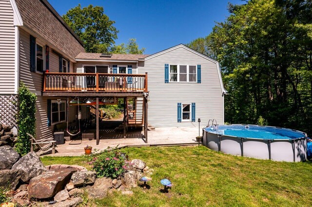 6 Sand Pond Rd, North Berwick, ME 03906 - rear view of house featuring stairway, a wooden deck, a yard, a patio area, and an outdoor pool