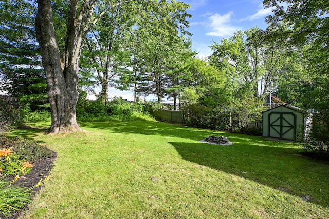 28 Colonial Rd, Westbrook, ME 04092 - view of yard featuring a shed and a fire pit