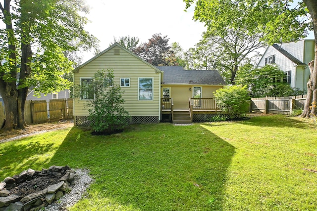 28 Colonial Rd, Westbrook, ME 04092 - back of property featuring a deck and a fenced backyard