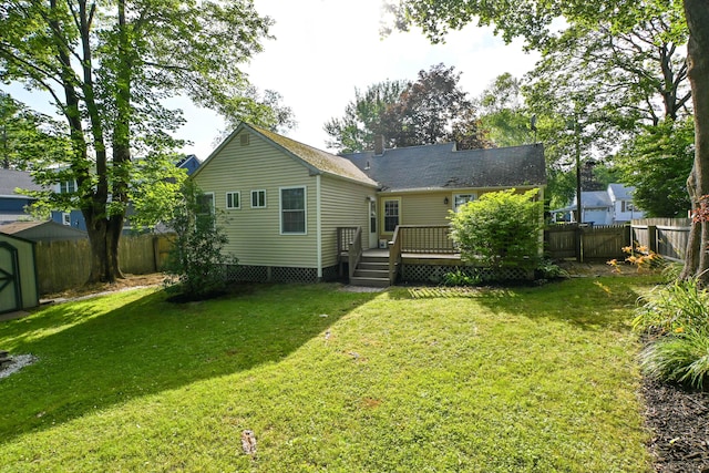 28 Colonial Rd, Westbrook, ME 04092 - rear view of house featuring a fenced backyard, a shed, and a deck