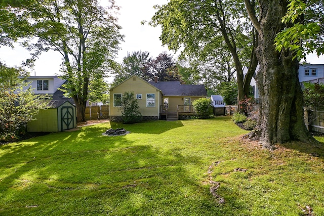 28 Colonial Rd, Westbrook, ME 04092 - fenced backyard featuring a storage unit and a deck