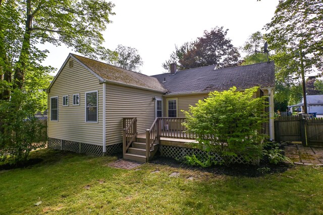 28 Colonial Rd, Westbrook, ME 04092 - rear view of house featuring a wooden deck and a chimney