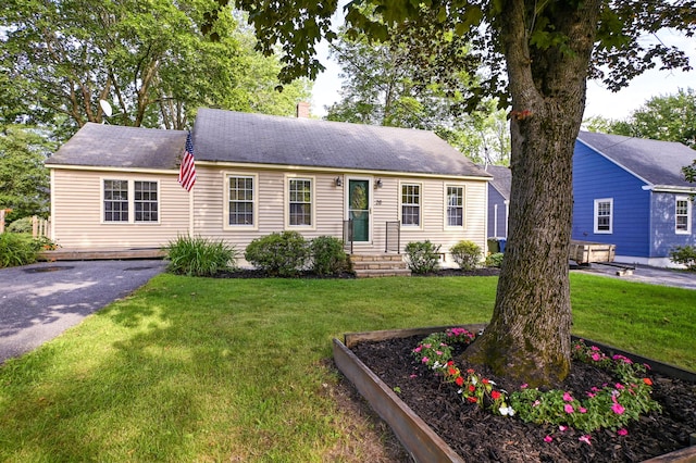 28 Colonial Rd, Westbrook, ME 04092 - view of front of house with a front yard, asphalt driveway, and a chimney