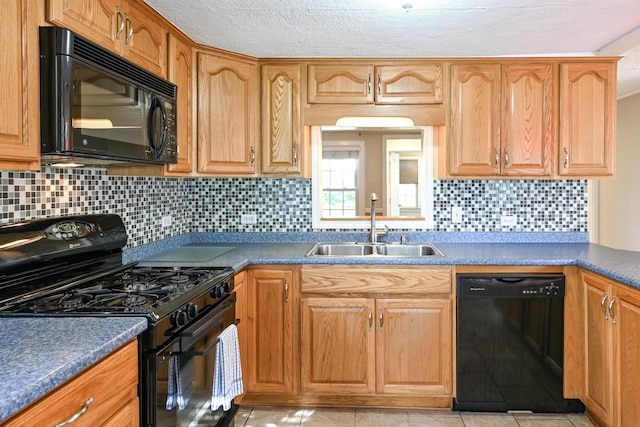 28 Colonial Rd, Westbrook, ME 04092 - kitchen with black appliances, tasteful backsplash, dark countertops, light tile patterned floors, and a textured ceiling
