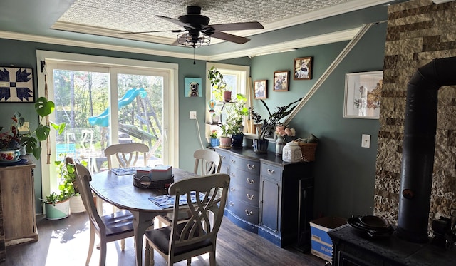 2670 Bennoch Rd, Old Town, ME 04468 - dining room with dark wood-style floors, ceiling fan, and crown molding